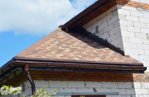 Asphalt shingle roofing on brick home